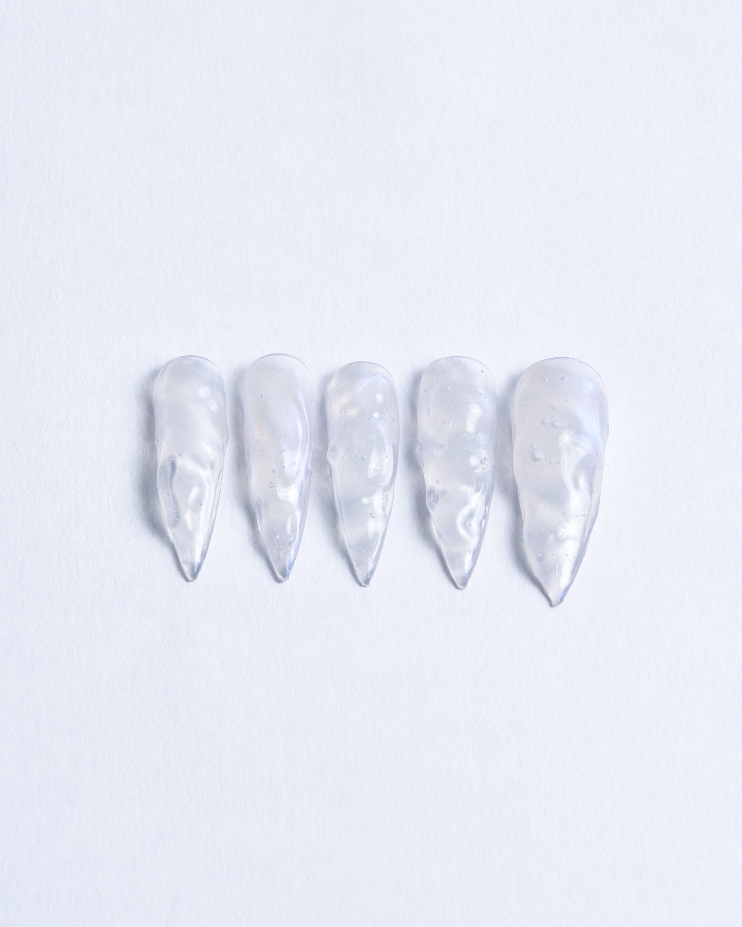 Long stiletto nails with 3D watery effect ocean waves inspired blue glazed base for daily or alternative look