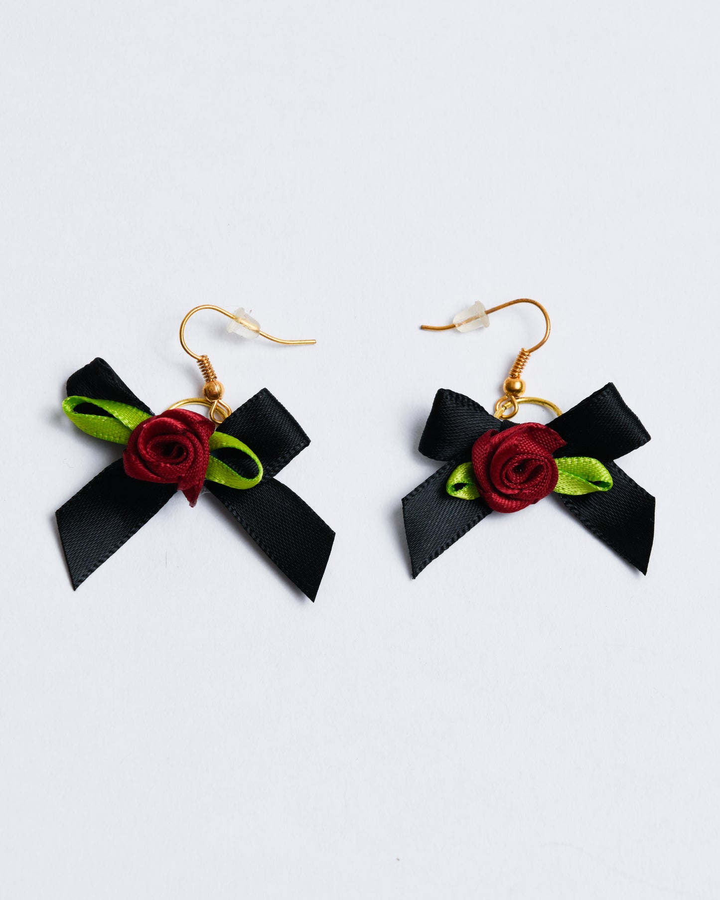 Fabric bows with fabric roses, set on copper earring hangers.