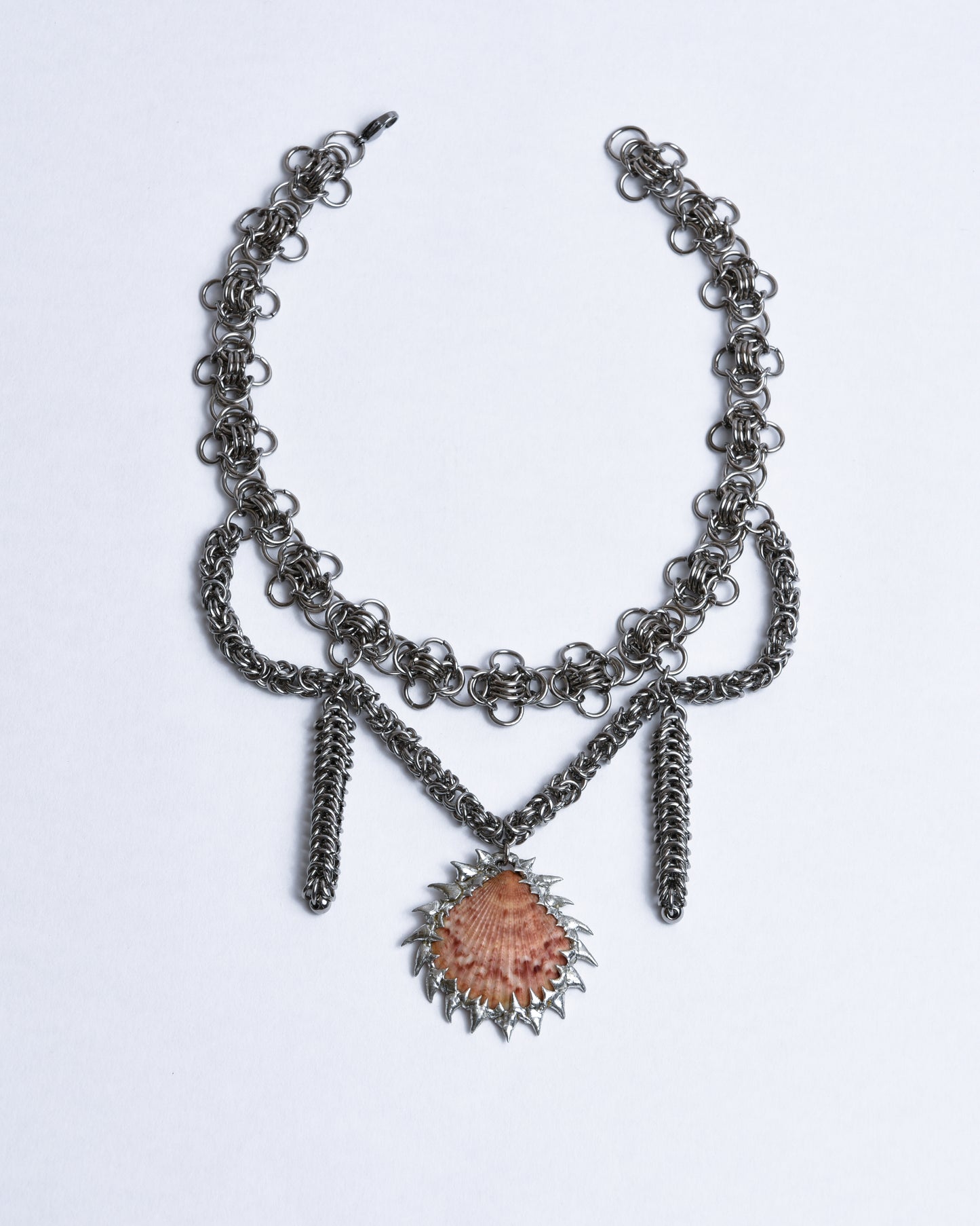 Silver stainless steel choker with stainless steel adornments and red scallop shell pendant with silver spikes