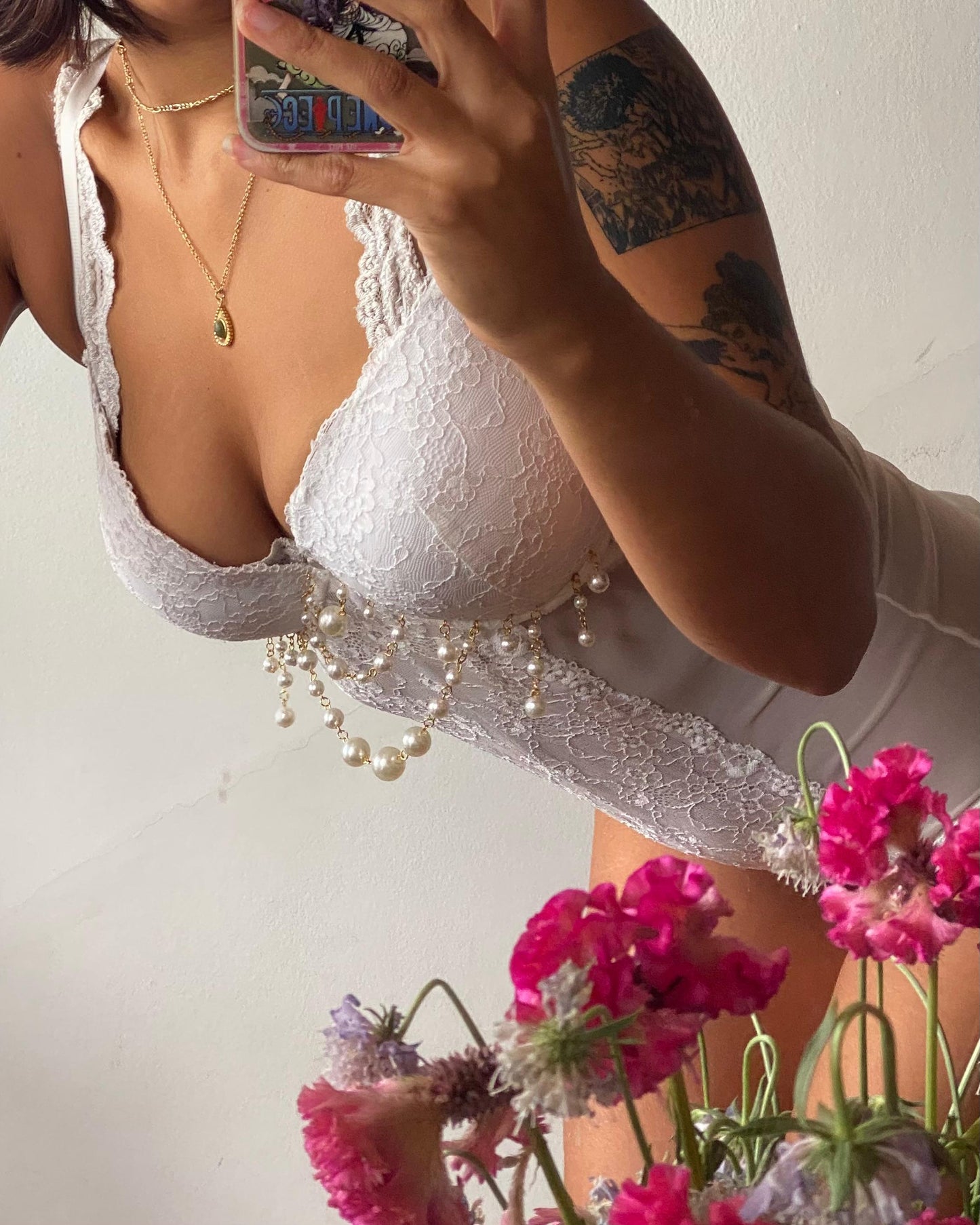 model wears white peal lace body
