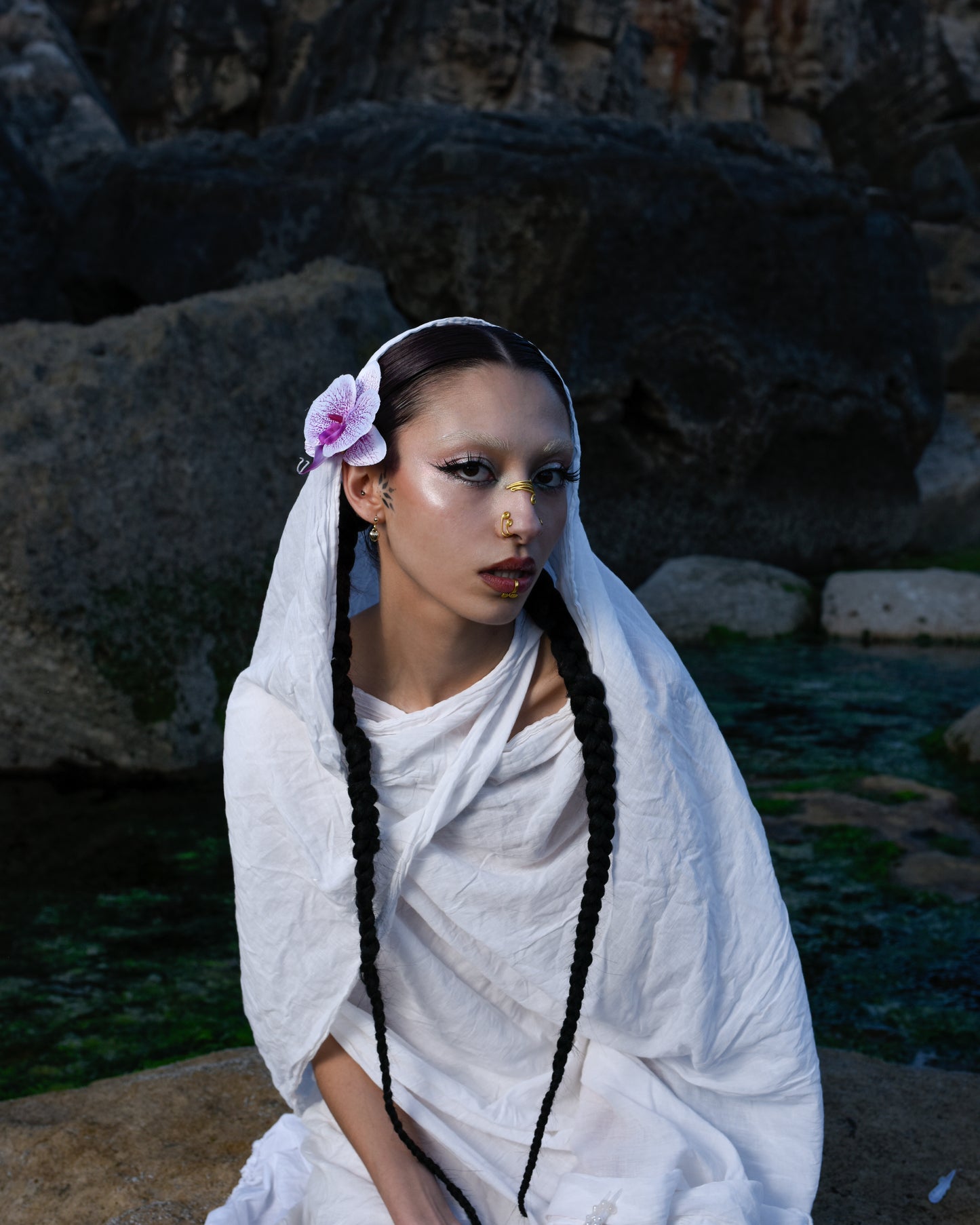 model wearing orchid flower pin in hair