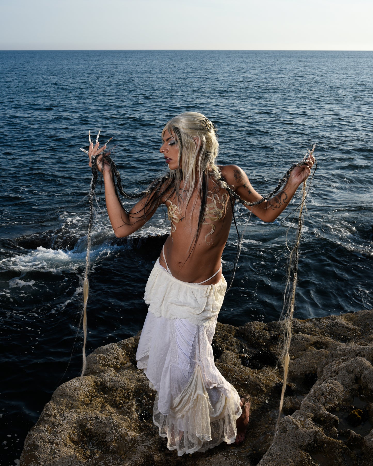 model wears bussis art hair as chest covers