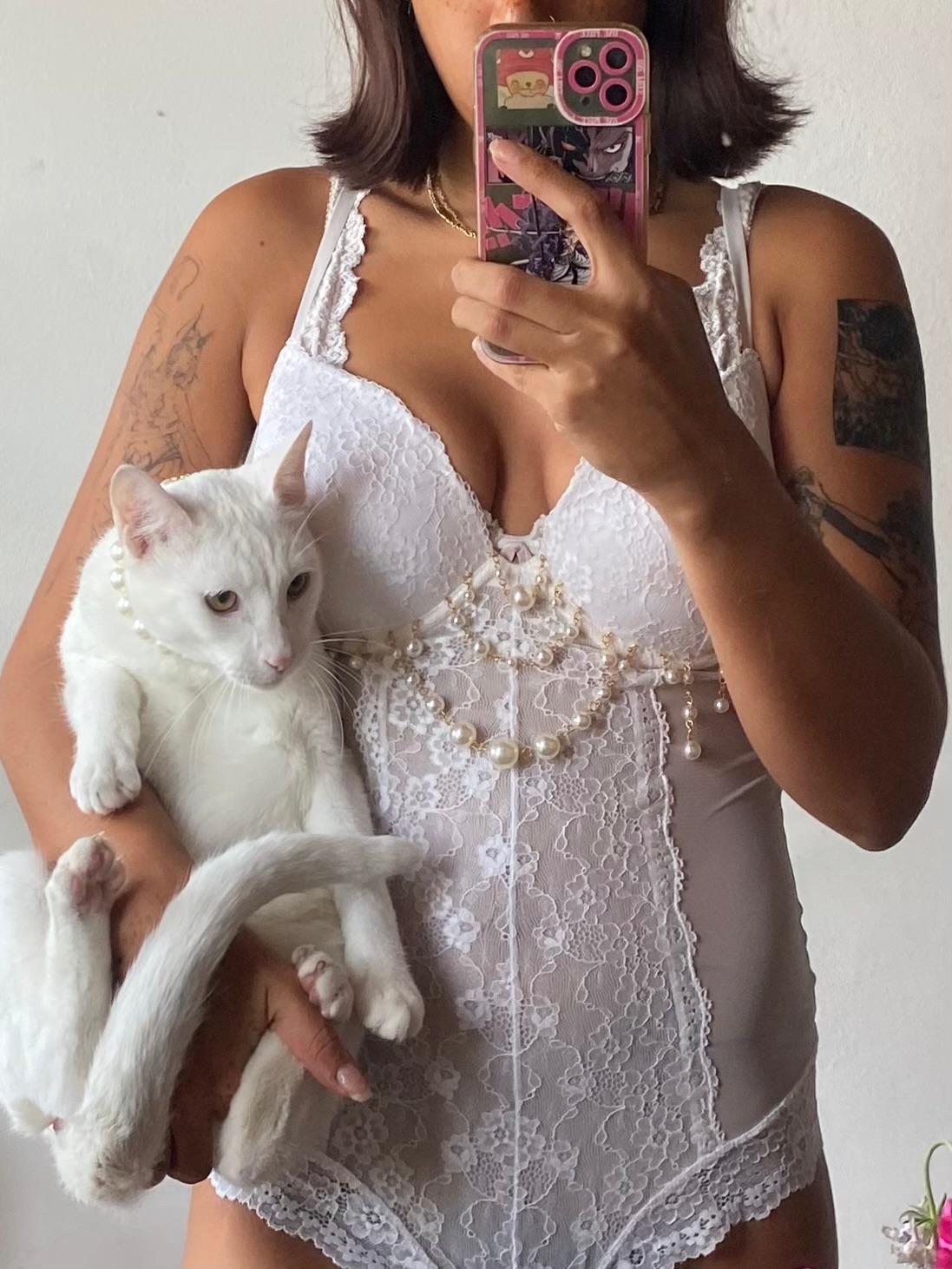 model wears white peal lace body