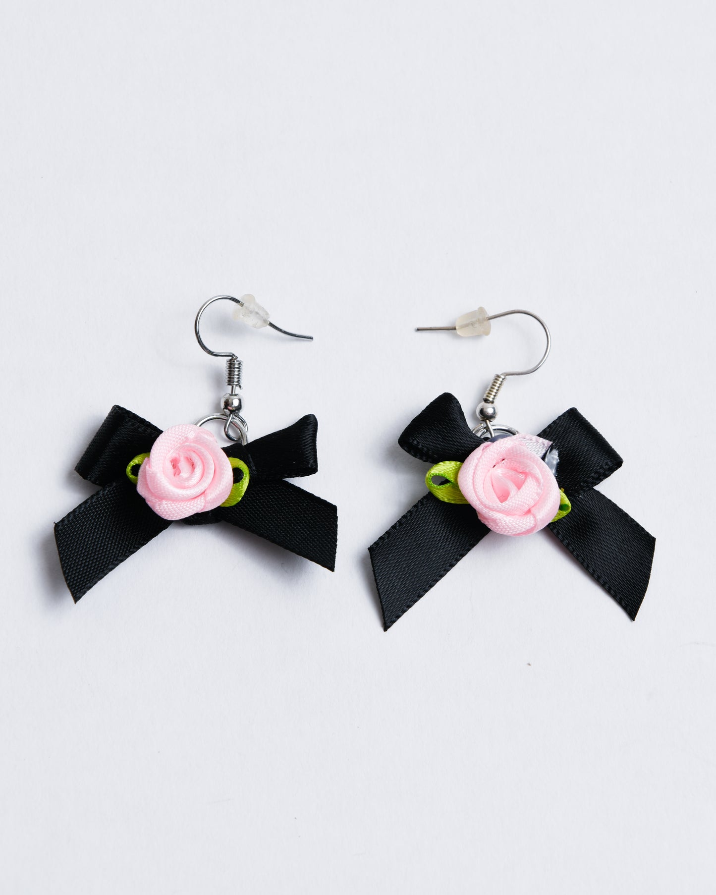 Fabric bows with fabric roses, set on copper earring hangers.