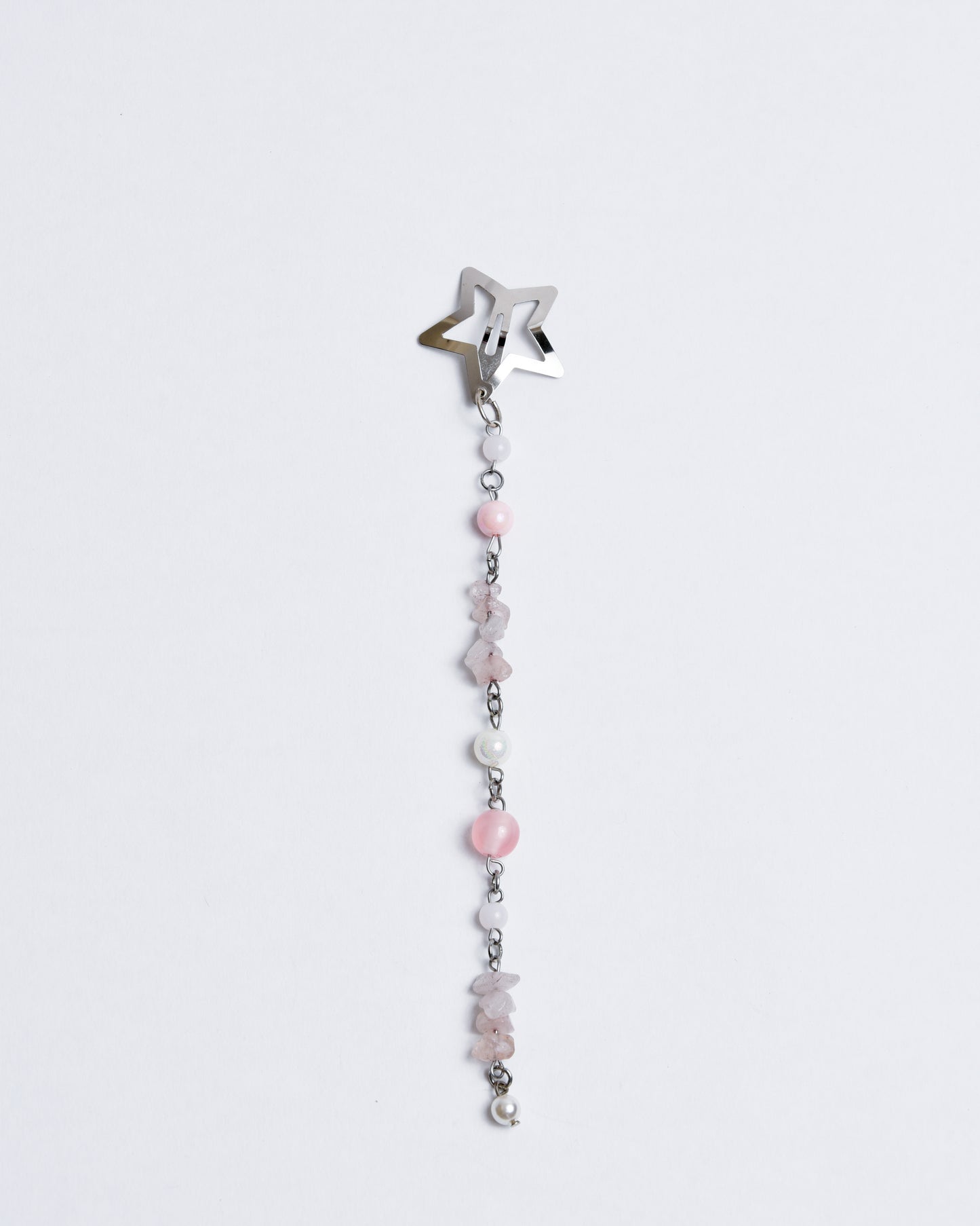 A silver star-shaped clip with beads hanging beneath it in a cascading pattern.