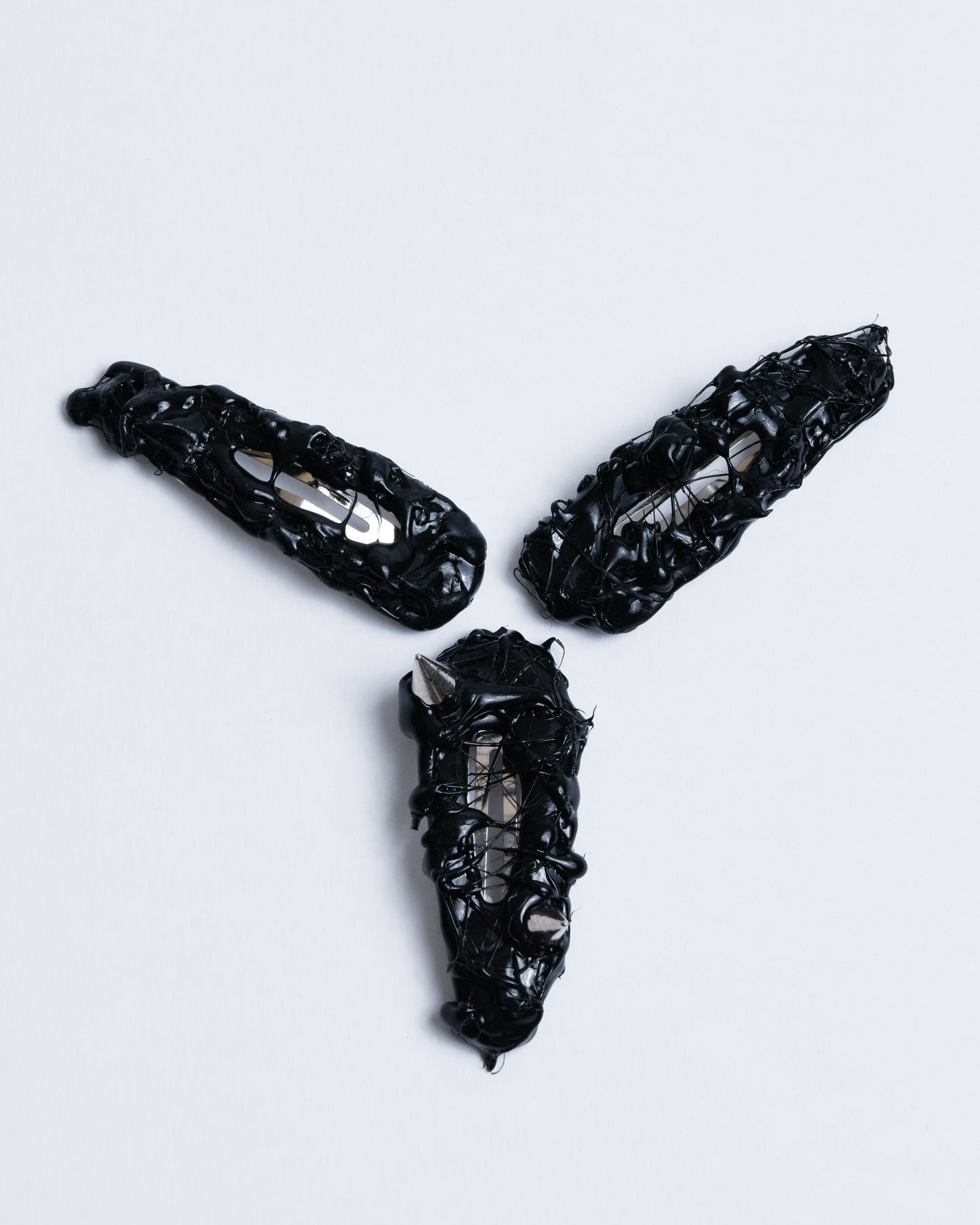 Black hair clip with textured gummy texture and spikes in it